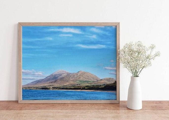 Unframed luxury photography print showcasing Croagh Patrick Mountain in County Mayo Ireland. Image showcases the outline of the mountain along with a blue sky.